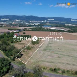 Prodej stavební parcely 3 371 m² Modlany