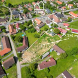 Prodej stavební parcely 2 325 m² Měcholupy