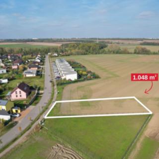Prodej stavební parcely 1048 m² Horoušany