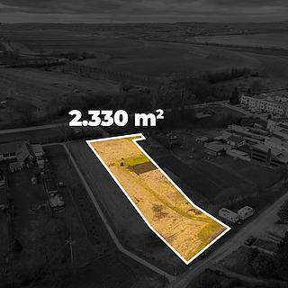 Prodej stavební parcely 2 330 m² Milešovice