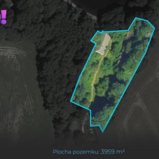 Prodej stavební parcely 3 959 m² Skuhrov