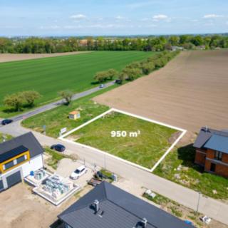 Prodej stavební parcely 950 m² Dubany