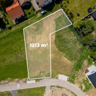 Prodej stavební parcely 1 213 m² Dubany
